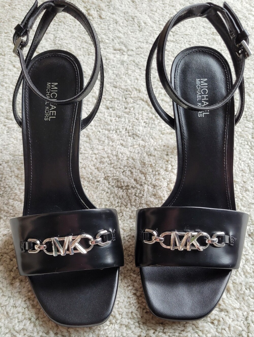 Modern Style Black Leather Stiletto Heels  MK  Emblem In Silver
